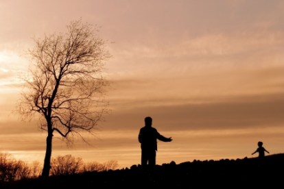 2853097 - silhouette of a parent opening his arms to a child running toward him