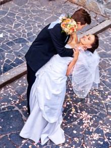 38740256 - groom carries his bride over back. outdoor.
