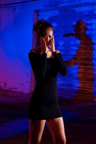 5620334 - young woman terrified of being attacked at night in  alley.