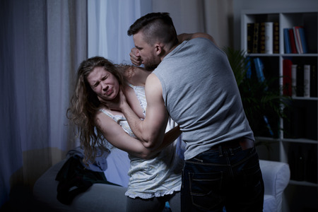 41848908 - husband beating and smothering wife during argument