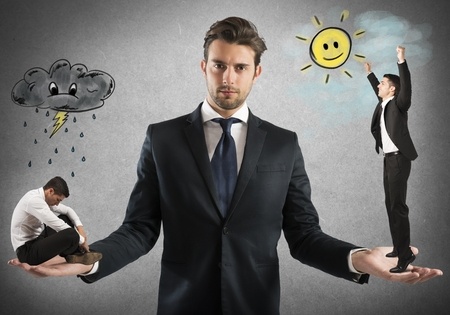 45734314 - businessman holds man sad and one happy